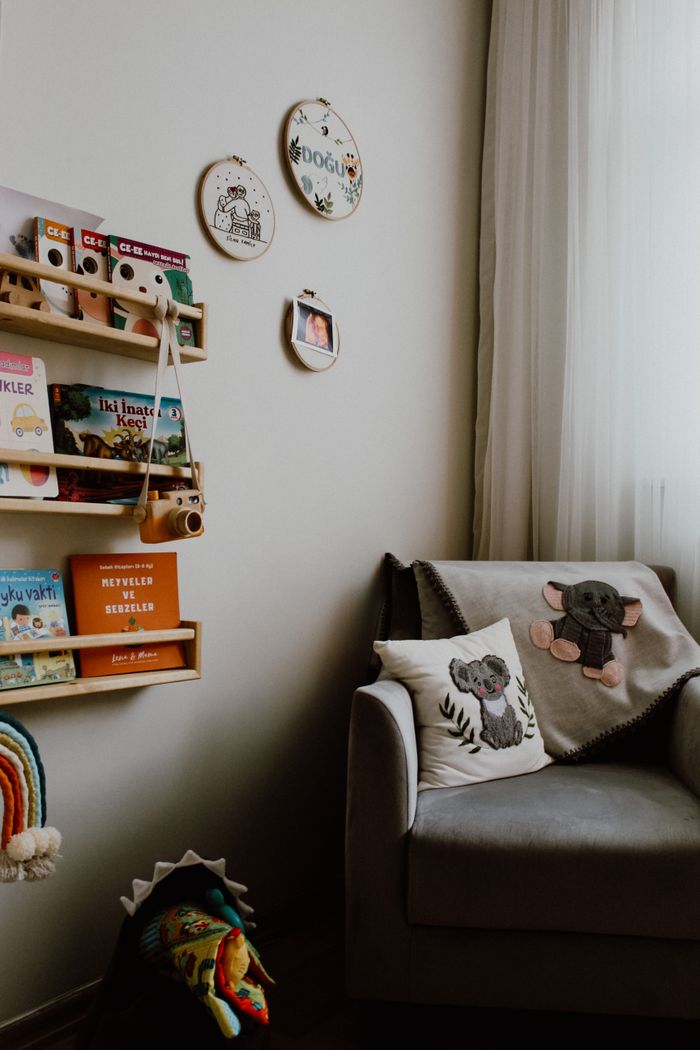 A warm children's room with books, toys, and a cozy chair in Istanbul.